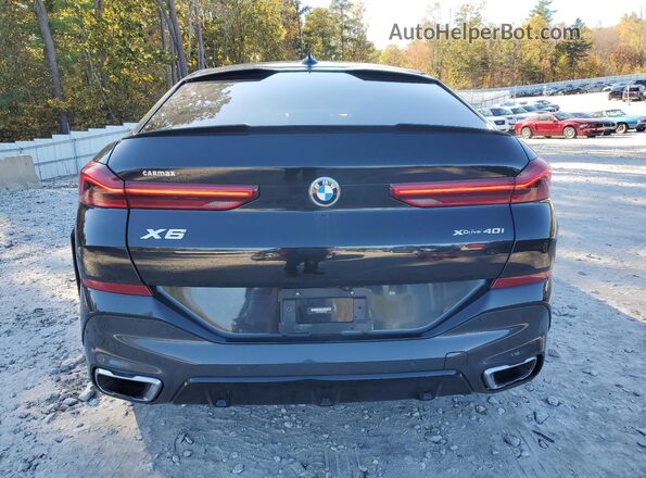 5UXCY6C02L9C11304 2020 BMW X6 Black Widok z tyłu