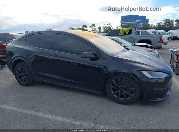 7SAXCBE59RF455887 2024 TESLA MODEL X Black Սալոնի հետևի տեսք