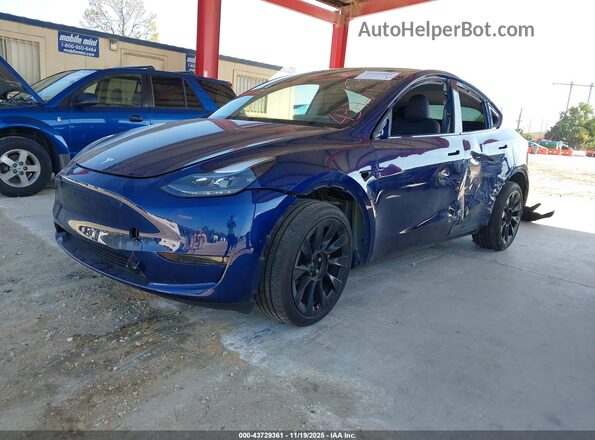 7SAYGDEE0RA238536 2024 TESLA MODEL Y Blue წინა მარცხენა ხედი სამი მეოთხედიდან