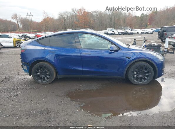 7SAYGDEE8RA217935 2024 TESLA MODEL Y Dark Blue Vista interior trasera
