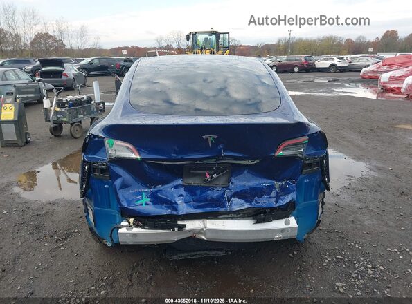 7SAYGDEE8RA217935 2024 TESLA MODEL Y Dark Blue 