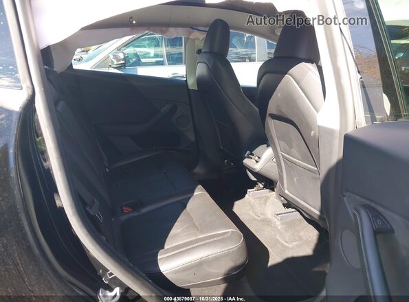 7SAYGDEEXRA218228 2024 TESLA MODEL Y Black Vista de la etiqueta del VIN
