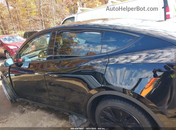 7SAYGDEEXRA218228 2024 TESLA MODEL Y Black Vista interior trasera