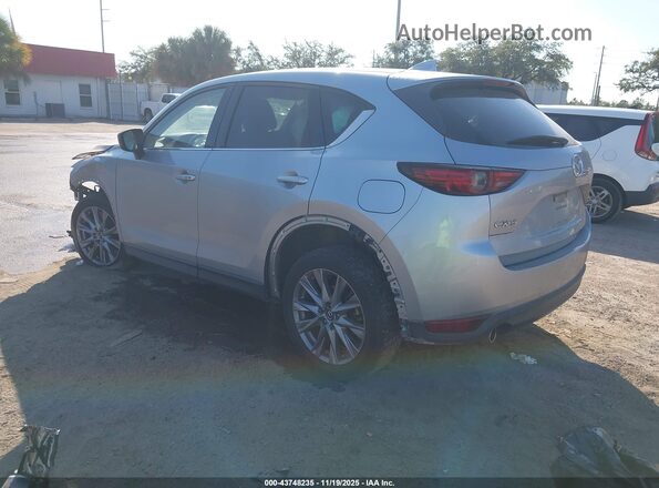 JM3KFADM4M1318043 2021 MAZDA CX-5 Silver Trasero izquierdo