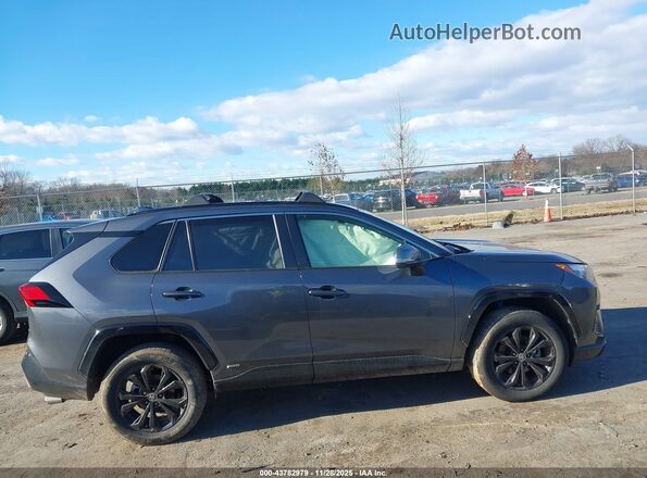 JTM16RFV6ND050251 2022 TOYOTA RAV4 HYBRID Gray Vista interior trasera