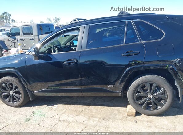 JTM16RFV7ND047407 2022 TOYOTA RAV4 HYBRID Black Vista interior trasera