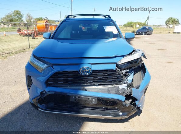 JTM16RFV7PD091796 2023 TOYOTA RAV4 HYBRID Blue Rear interior view