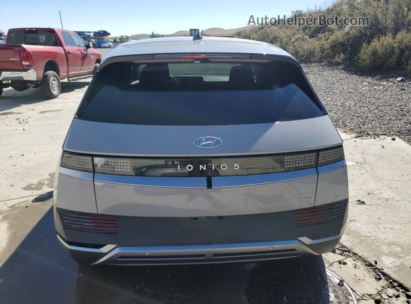 KM8KMDAF3NU052418 2022 HYUNDAI IONIQ Gray Widok z tyłu