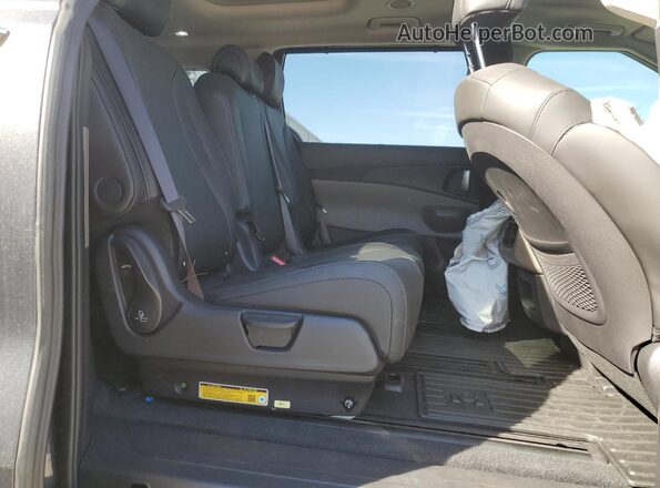 KNDNE5KA1S6069953 2025 KIA CARNIVAL Charcoal Вид задньої частини салону
