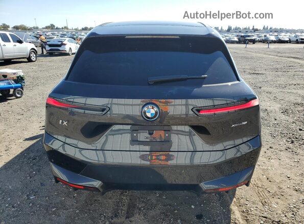 WB523CF09SCT24179 2025 BMW IX Black Rear view