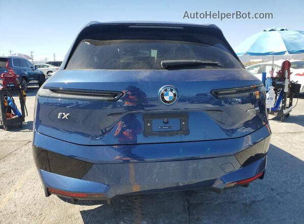 WB523CF0XSCS38055 2025 BMW IX Blue Հետևի տեսք