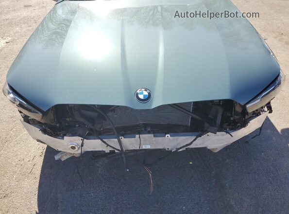 WBA53FJ07RCS28049 2024 BMW 5 SERIES Teal Vista interior trasera