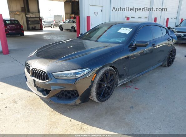 WBAGV8C01NCH91316 2022 BMW M8 Black Առջևի ձախ երեք քառորդ տեսարան