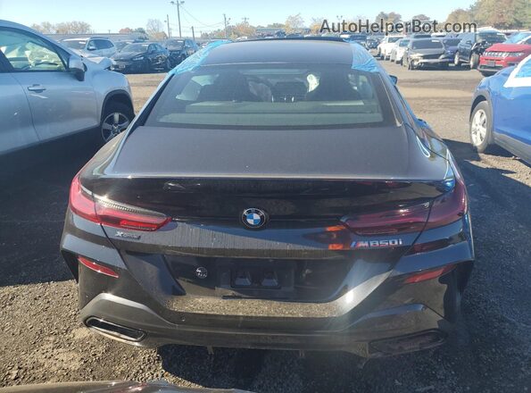 WBAGV8C01NCJ71188 2022 BMW M8 Черный Вид сзади
