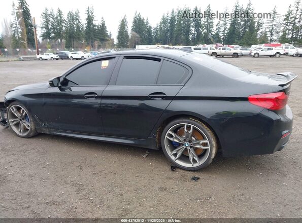 WBAJS7C09LCD47686 2020 BMW 5 SERIES Black Widok wnętrza z tyłu