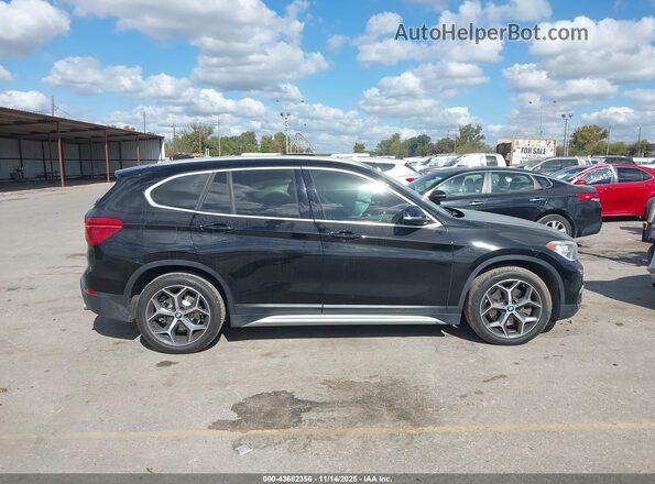 WBXHT3C52K3H35489 2019 BMW X1 Black Vista interior trasera