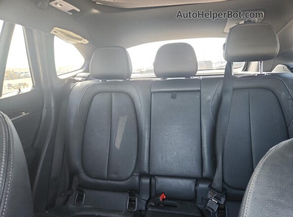 WBXHT3Z33G4A50280 2016 BMW X1 Black Vista de los asientos traseros