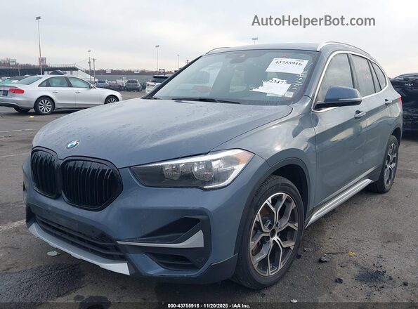 WBXJG9C01M5T18141 2021 BMW X1 Light Blue წინა მარცხენა ხედი სამი მეოთხედიდან