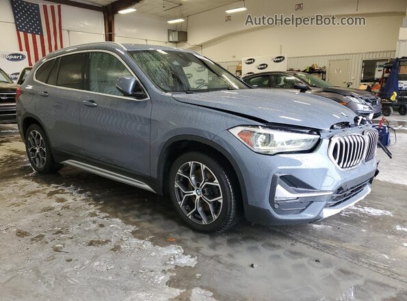 WBXJG9C03L5P84989 2020 BMW X1 Blue Delantero derecho