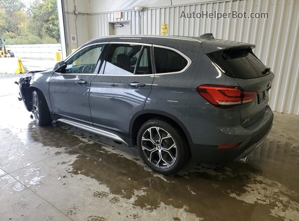 WBXJG9C03L5P84989 2020 BMW X1 Blue Trasero izquierdo