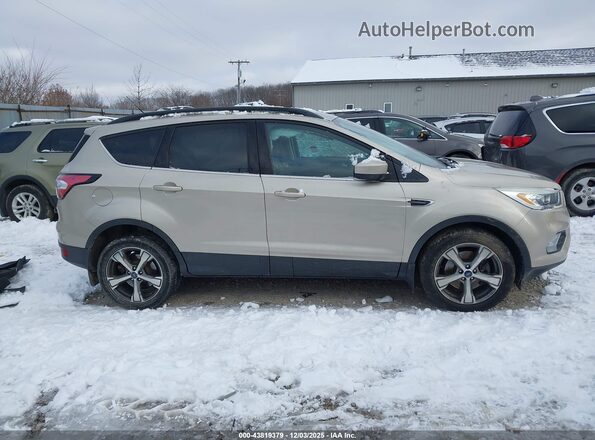 1FMCU9GD7HUC21352 2017 FORD ESCAPE Tan Widok wnętrza z tyłu