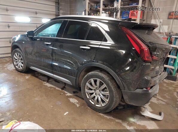 1GYFZDR42MF013083 2021 CADILLAC XT4 Black Trasero izquierdo