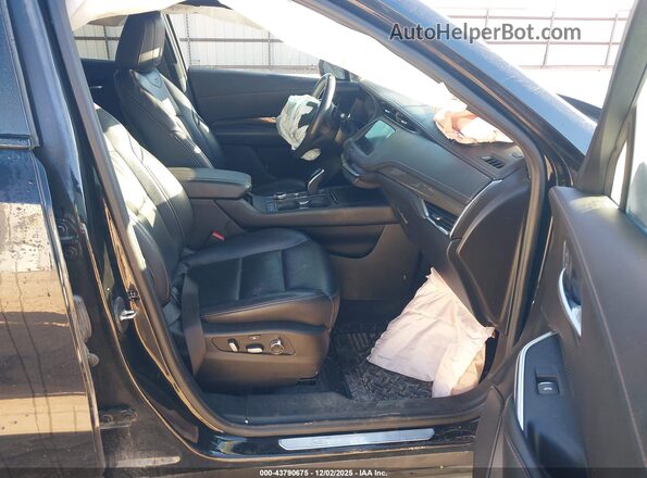 1GYFZER47NF104583 2022 CADILLAC XT4 Black წინა სალონის ხედი