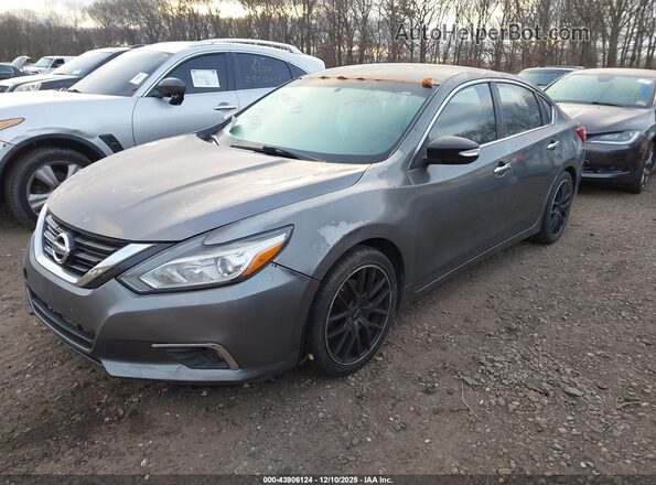 1N4AL3AP0JC164007 2018 NISSAN ALTIMA Gray Vista tres cuartos delantera izquierda