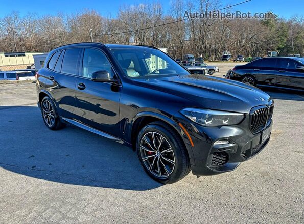 5UXJU4C08M9G37880 2021 BMW X5 Black Front view