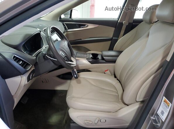 2LMPJ6JRXJBL14203 2018 LINCOLN MKX Бежевый Вид салона спереди