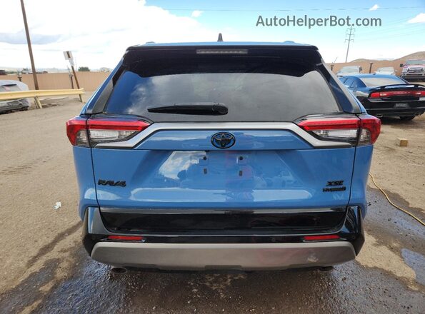 2T3E6RFV2NW032298 2022 TOYOTA RAV4 Blue Widok z tyłu