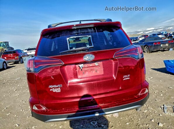 2T3RFREV4JW778877 2018 TOYOTA RAV4 Red Rear view