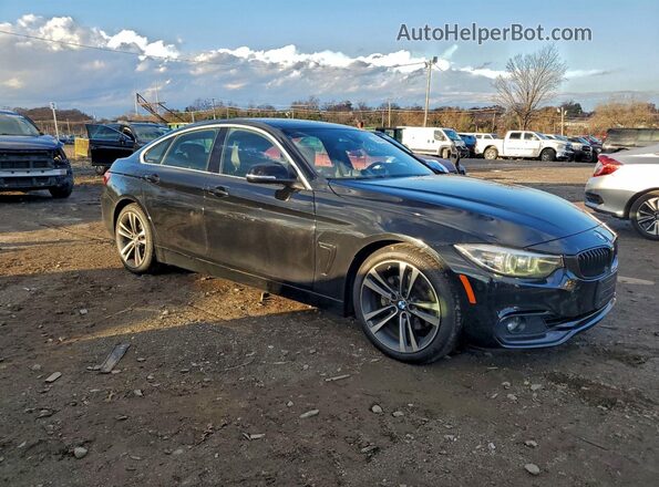 WBA4J1C06LCD66970 2020 BMW 4 SERIES Черный Вид спереди