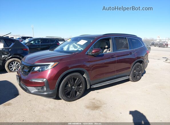 5FNYF5H2XNB005221 2022 HONDA PILOT Maroon Vista tres cuartos delantera izquierda