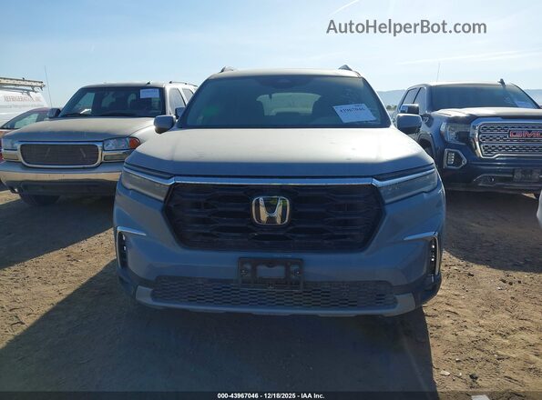 5FNYG2H71PB011399 2023 HONDA PILOT Light Blue Vista interior trasera