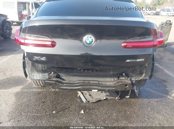 5UX2V1C04M9E74368 2021 BMW X4 Black Front view