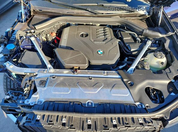 5UX33DT08S9118141 2025 BMW X4 Blue Rear interior view