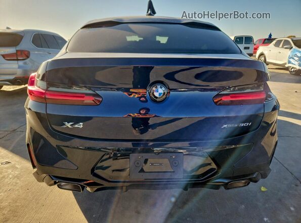 5UX33DT08S9118141 2025 BMW X4 Blue Rear view
