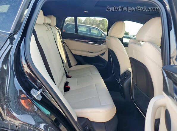 5UX43DT04P9S10245 2023 BMW X4 Black Vista interior trasera