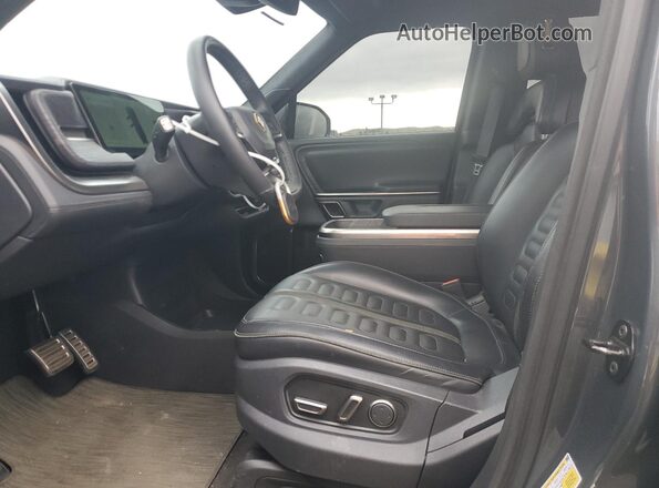 7PDSGABA4RN042504 2024 RIVIAN R1S Charcoal Front interior view