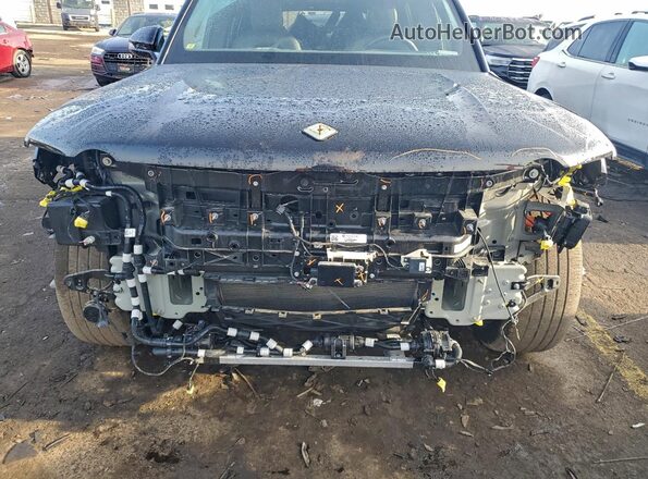 7PDSGCBA4RN032504 2024 RIVIAN R1S Black Սալոնի հետևի տեսք