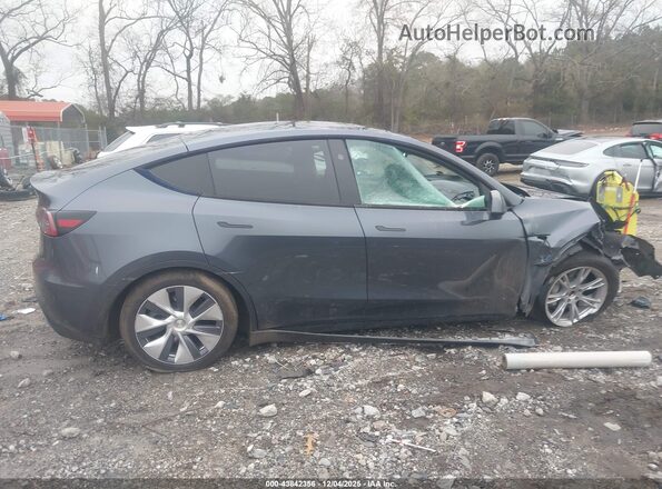7SAYGDEE3PA192049 2023 TESLA MODEL Y Blue Սալոնի հետևի տեսք