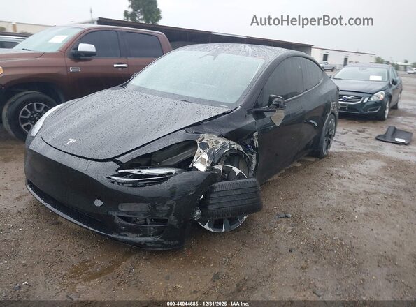7SAYGDEE7PF853679 2023 TESLA MODEL Y Black წინა მარცხენა ხედი სამი მეოთხედიდან