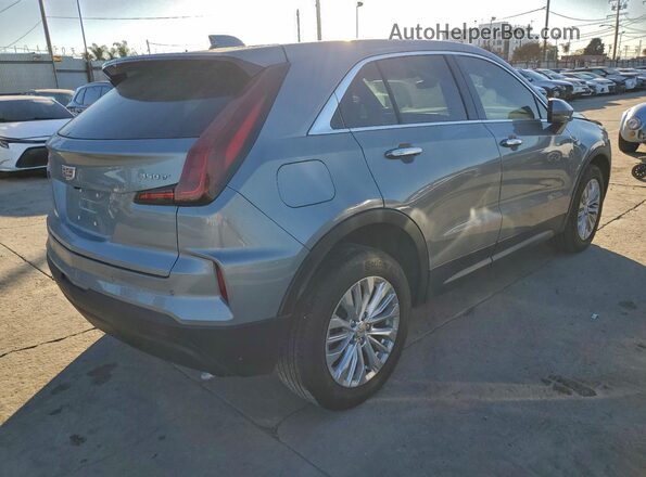 1GYAZAR45RF244379 2024 CADILLAC XT4 Серебряный 