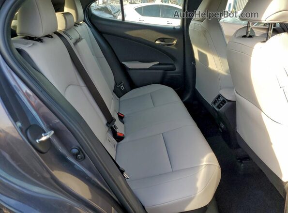 JTHB6JBH5P2154183 2023 LEXUS UX Charcoal Vista interior trasera