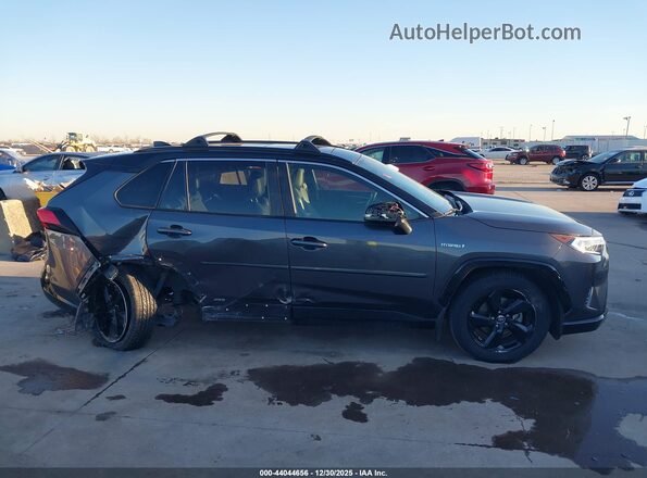 JTME6RFV0MJ009938 2021 TOYOTA RAV4 HYBRID Gray Vista interior trasera