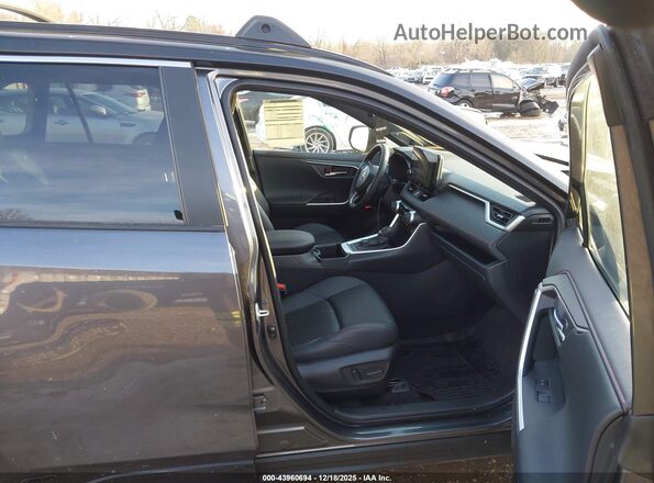 JTMFB3FV8SD250512 2025 TOYOTA RAV4 PLUG-IN HYBRID Gray Front interior view