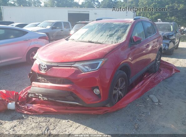 JTMWFREV7GJ096716 2016 TOYOTA LE Red წინა მარცხენა ხედი სამი მეოთხედიდან