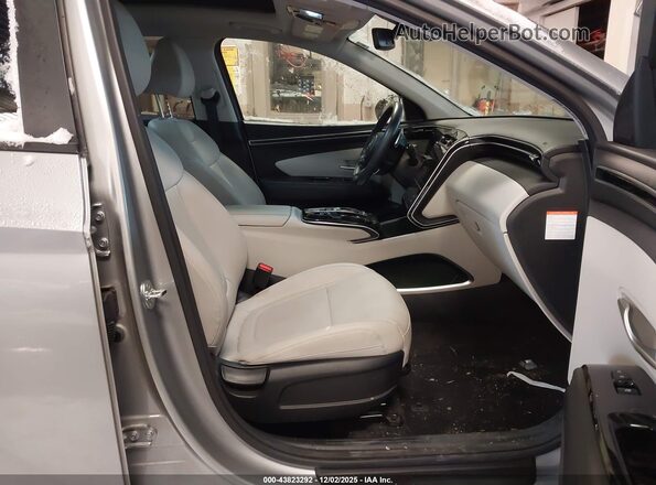 KM8JCCD18RU204479 2024 HYUNDAI TUCSON HYBRID Silver Вид салону спереду