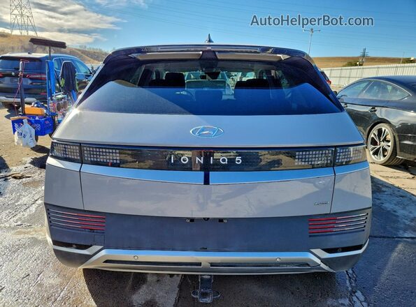 KM8KMDAF7PU143758 2023 HYUNDAI IONIQ Gray Rear view